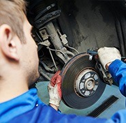 mechanic changing a brake disc
