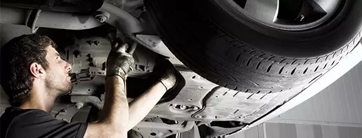 CLUTCH REPAIR AND REPLACEMENT Watford and Hertfordshire -mechanic inspecting car clutch